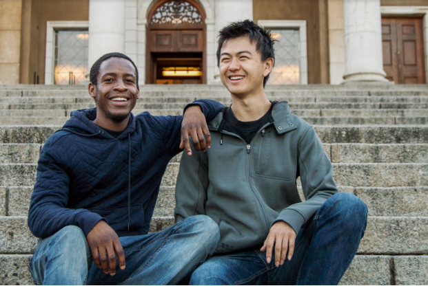 Two students sitting outside